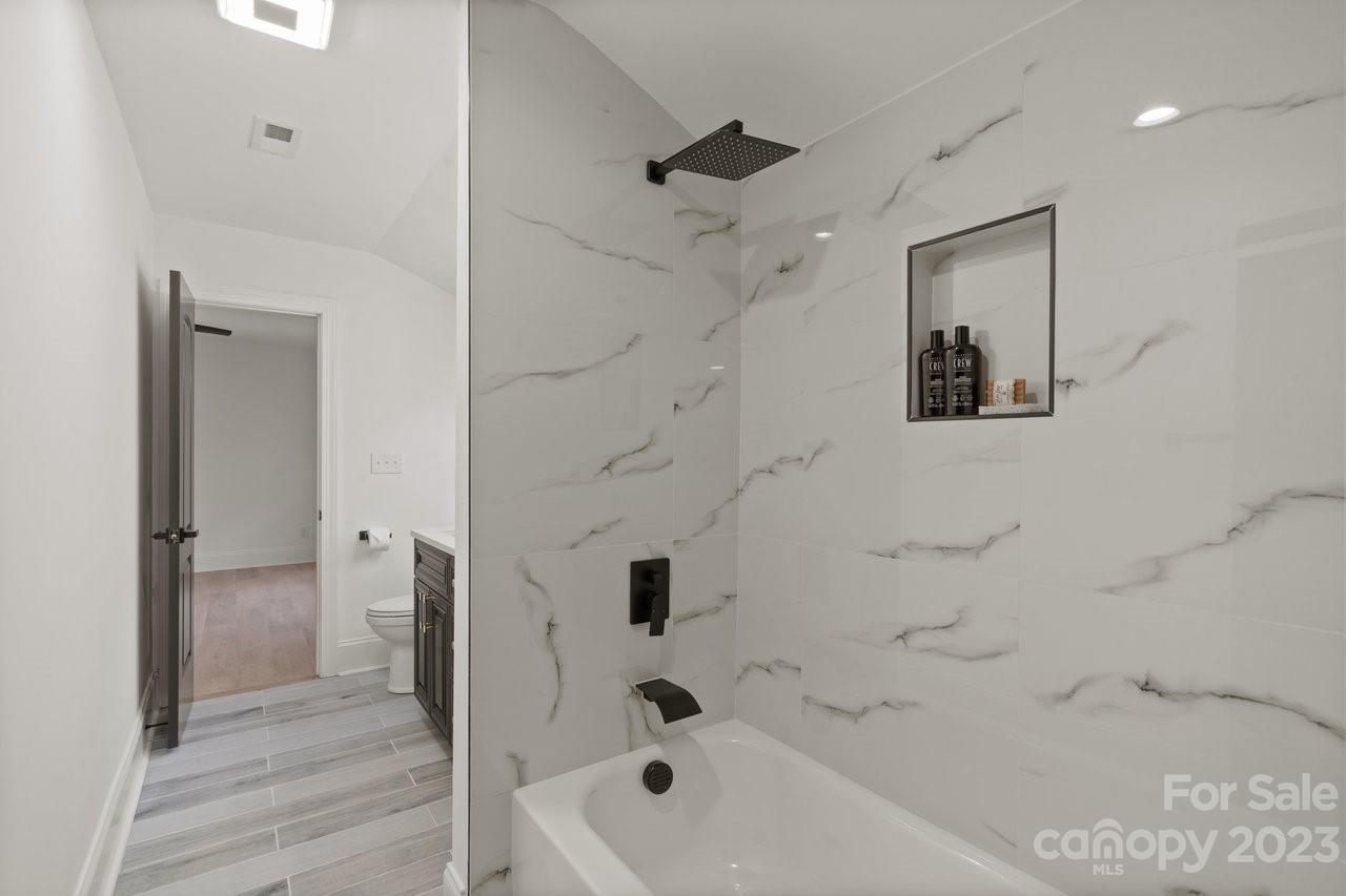 4215 Kuykendall Road Charlotte, NC 28270 - Photo 35 of 43 a bathroom with a bathtub and a shower