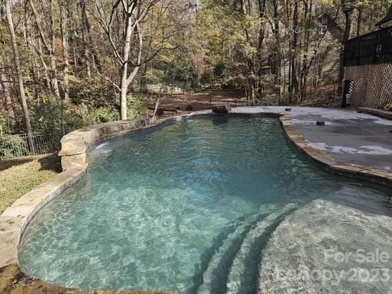 4215 Kuykendall Road Charlotte, NC 28270 - Photo 40 of 43 a view of a swimming pool with a yard