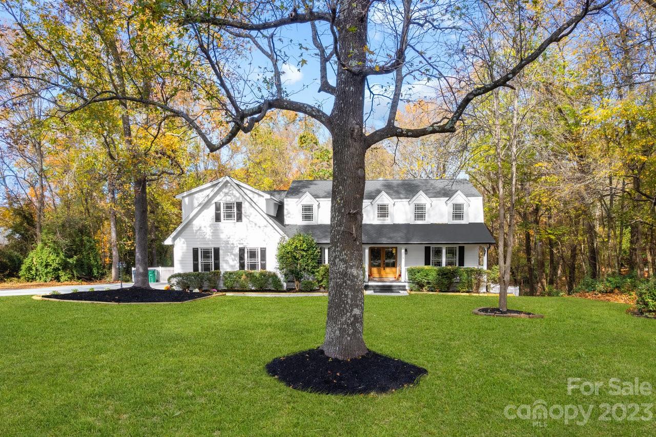 4215 Kuykendall Road Charlotte, NC 28270 - Photo 4 of 43 a front view of a building with garden and trees