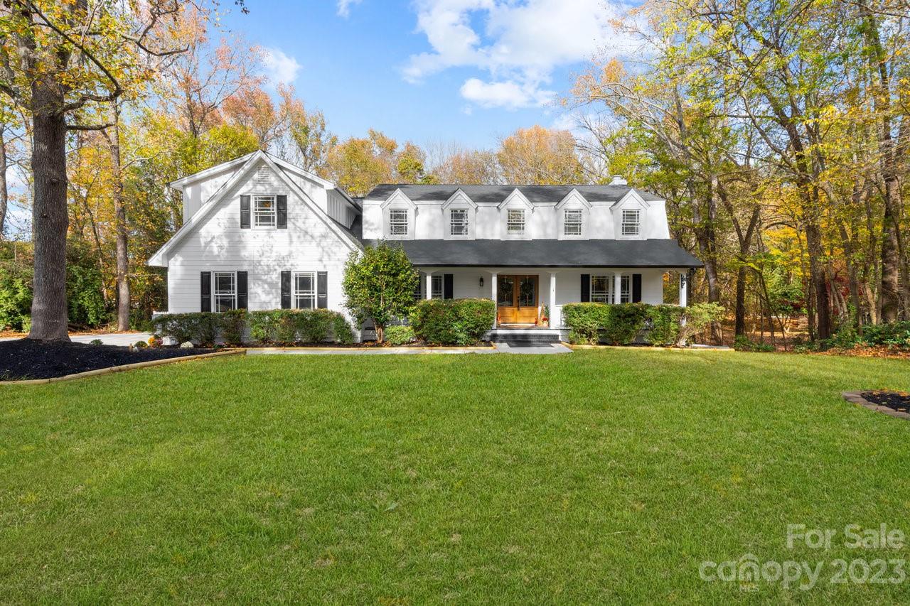 4215 Kuykendall Road Charlotte, NC 28270 - Photo 5 of 43 a front view of a house with a yard