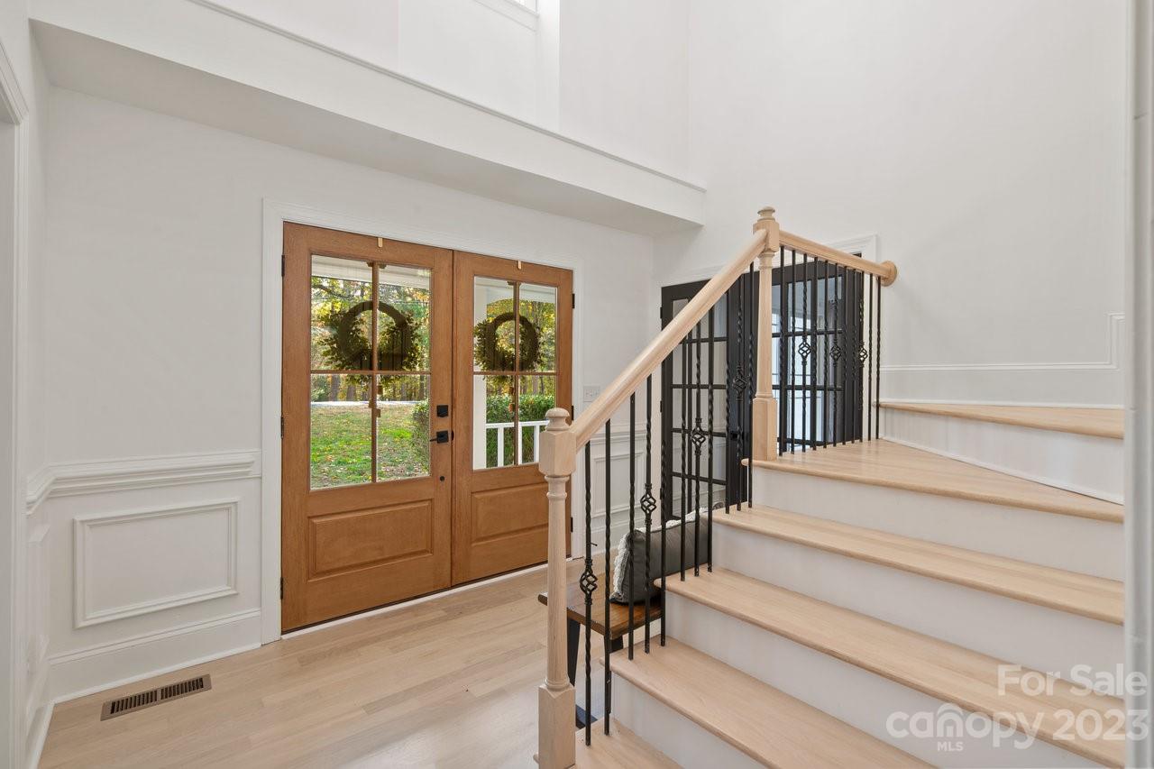 4215 Kuykendall Road Charlotte, NC 28270 - Photo 9 of 43 a view of entryway and hall with wooden floor