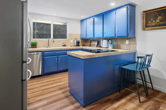 a kitchen with a sink and cabinets