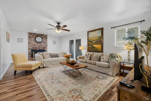 a living room with furniture fireplace and a flat screen tv