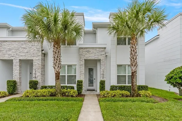 front view of a house with a garden