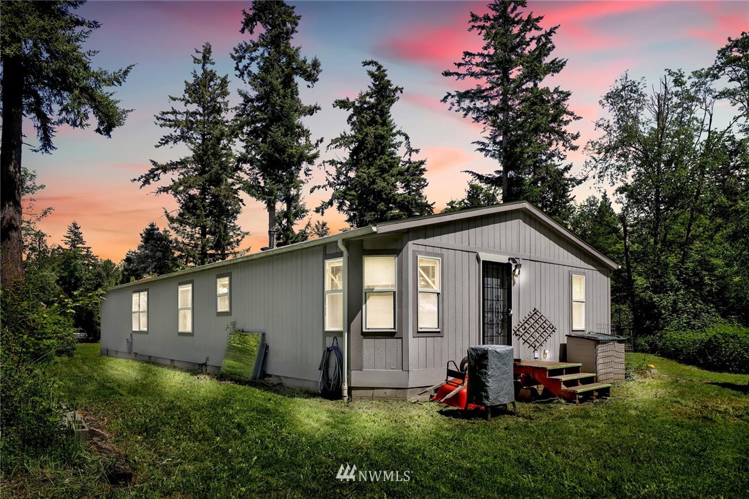 4355 Bridger Road Blaine, WA 98230 - Photo 2 of 12 a front view of house with a garden