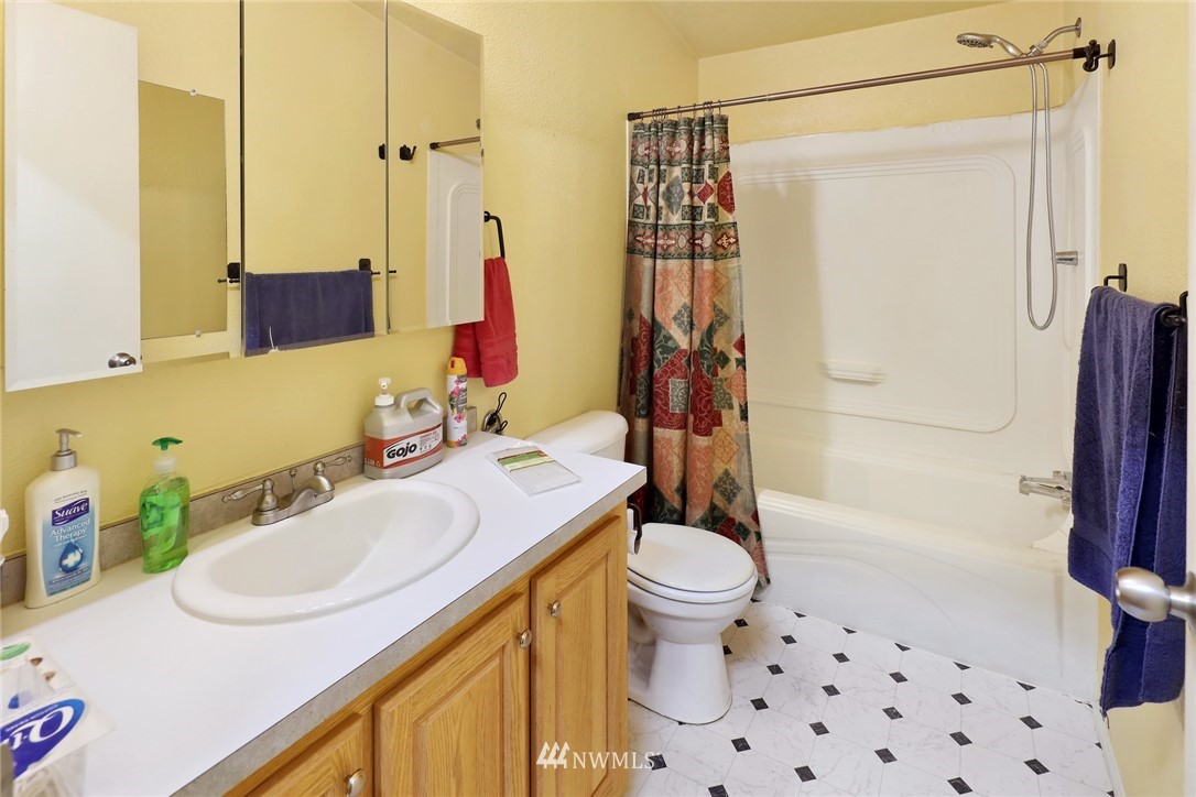 4355 Bridger Road Blaine, WA 98230 - Photo 11 of 12 a bathroom with a sink toilet and shower
