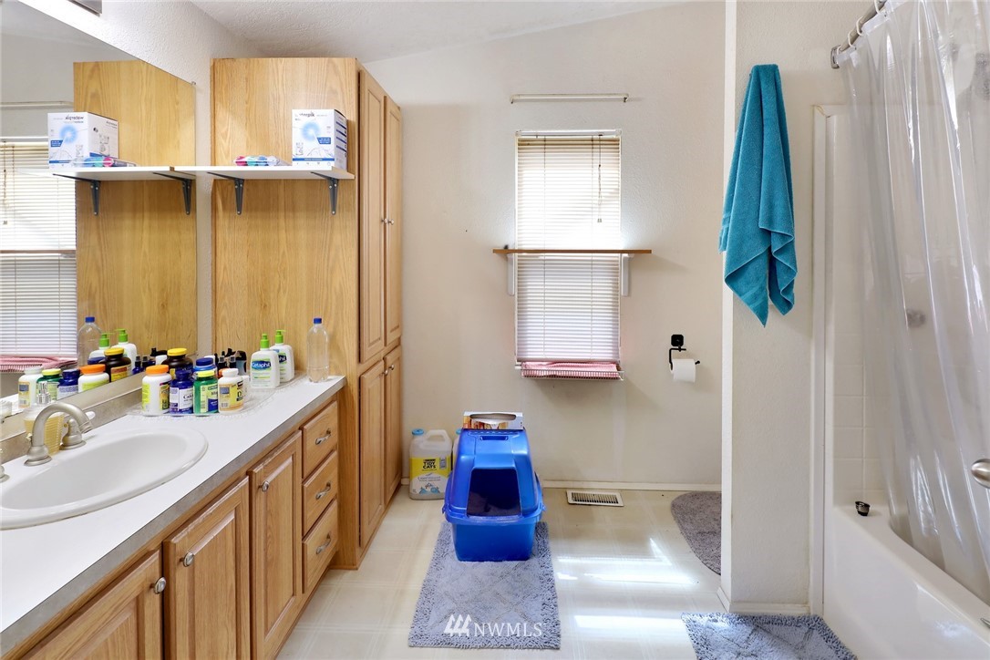 4355 Bridger Road Blaine, WA 98230 - Photo 12 of 12 a bathroom with a sink and a mirror