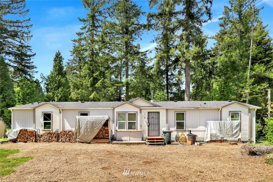 4355 Bridger Road Blaine, WA 98230 - Photo 6 of 12 a front view of a house with a yard covered with snow