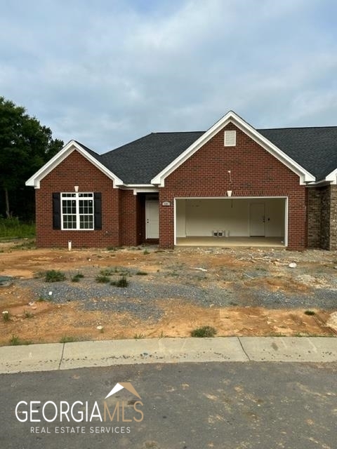 121 Southwest Freedoms Way Calhoun, GA 30701 - Photo 1 of 1 a front view of a house with a garden