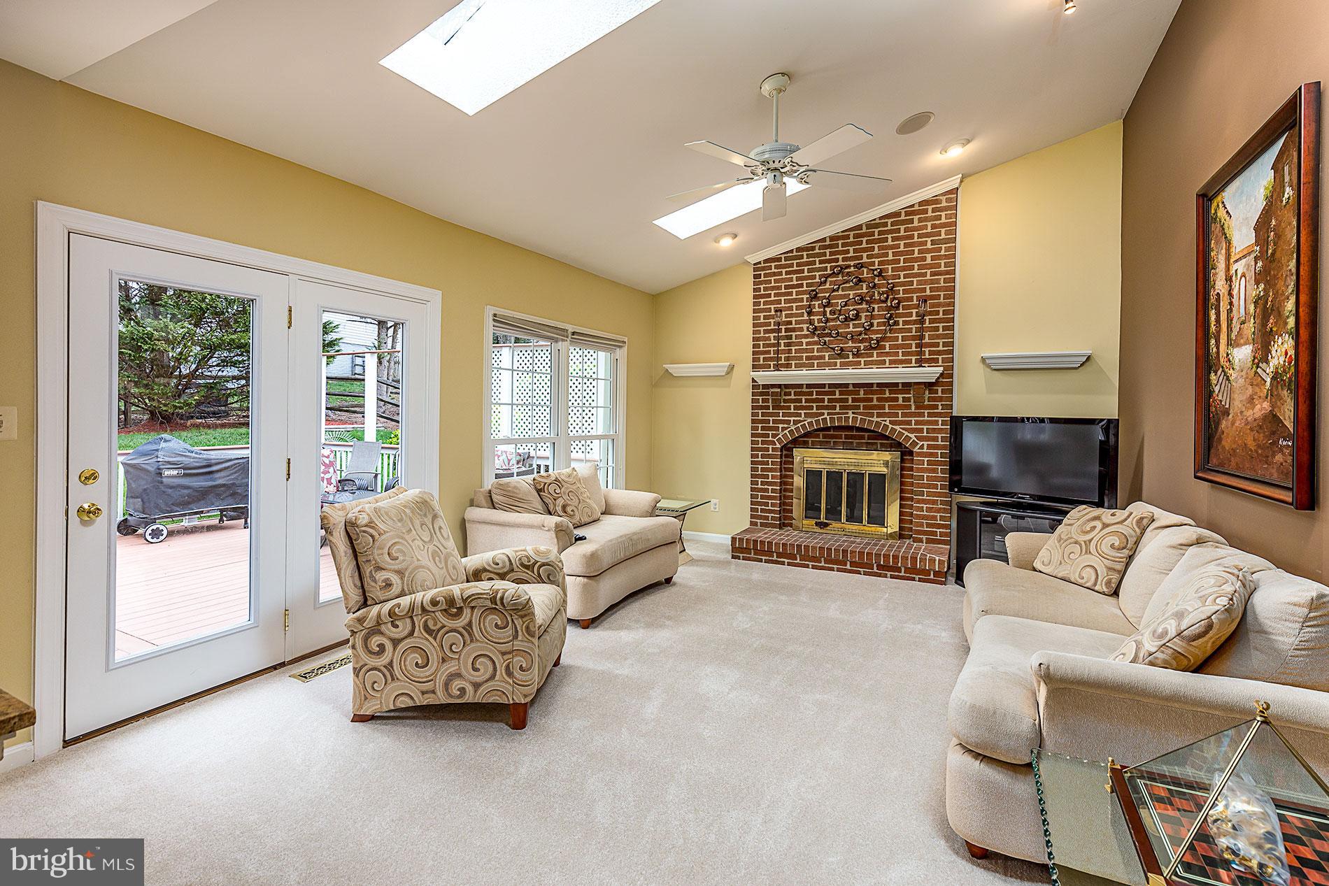 6453 Springhouse Circle Clifton, VA 20124 - Photo 11 of 30 a living room with furniture fireplace and flat screen tv