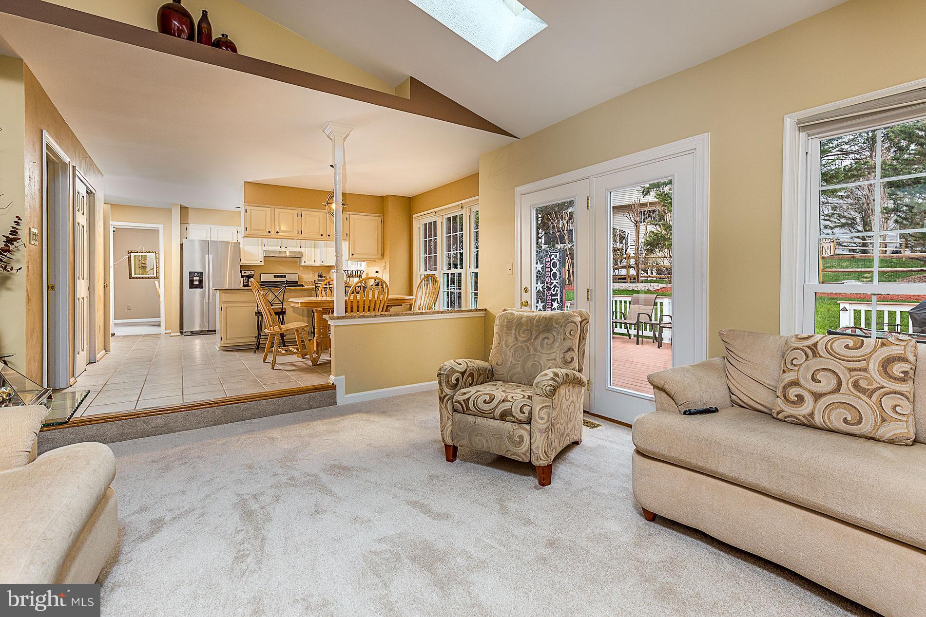 6453 Springhouse Circle Clifton, VA 20124 - Photo 12 of 30 a living room with furniture and floor to ceiling windows