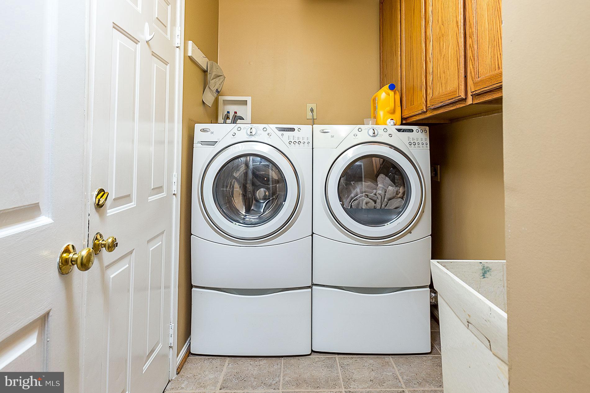6453 Springhouse Circle Clifton, VA 20124 - Photo 16 of 30 a utility room with dryer and washer