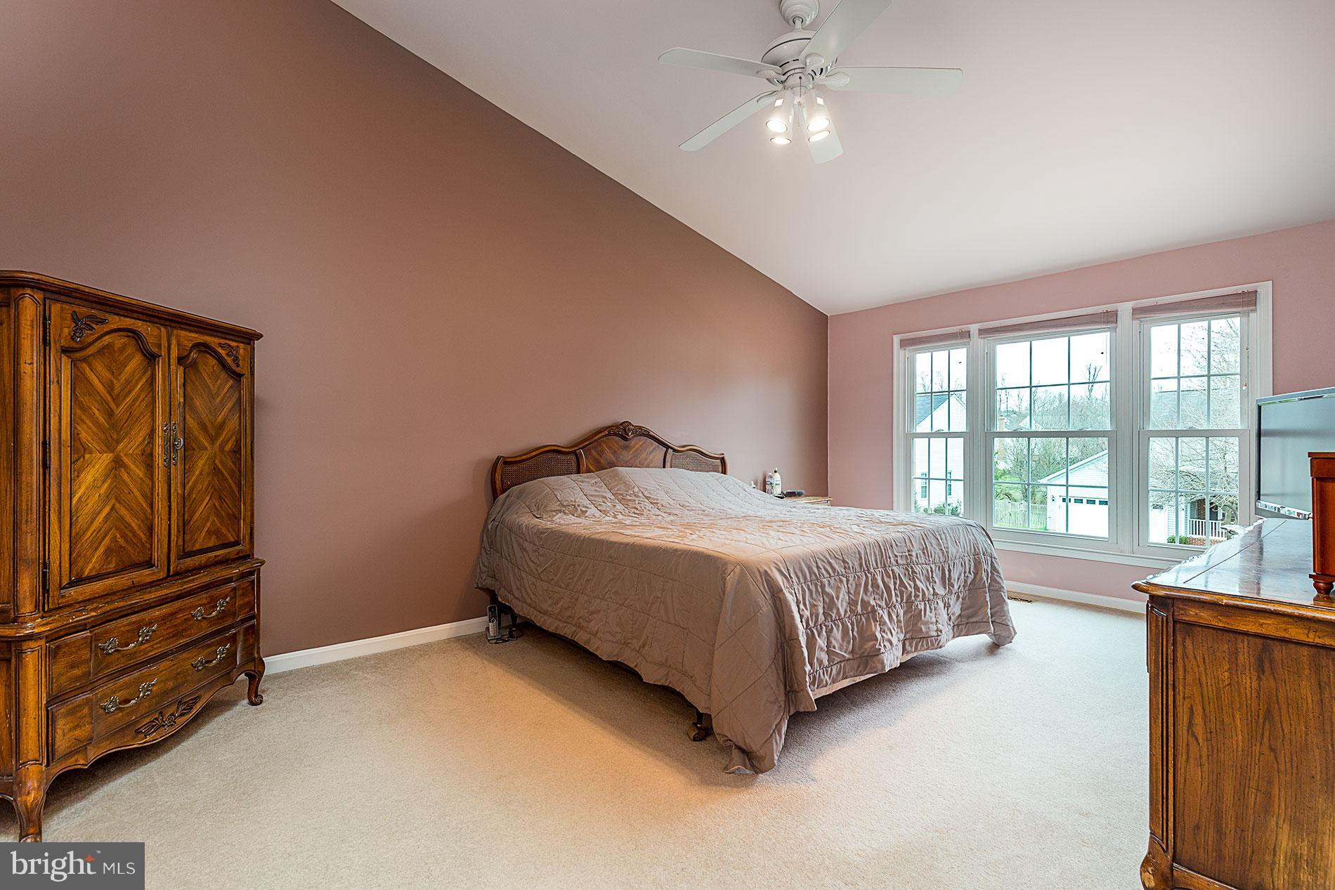 6453 Springhouse Circle Clifton, VA 20124 - Photo 17 of 30 a bedroom with a bed dresser and a window