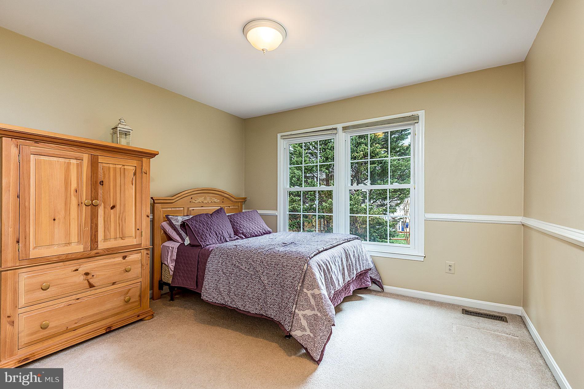 6453 Springhouse Circle Clifton, VA 20124 - Photo 21 of 30 a bed room with a bed and a window