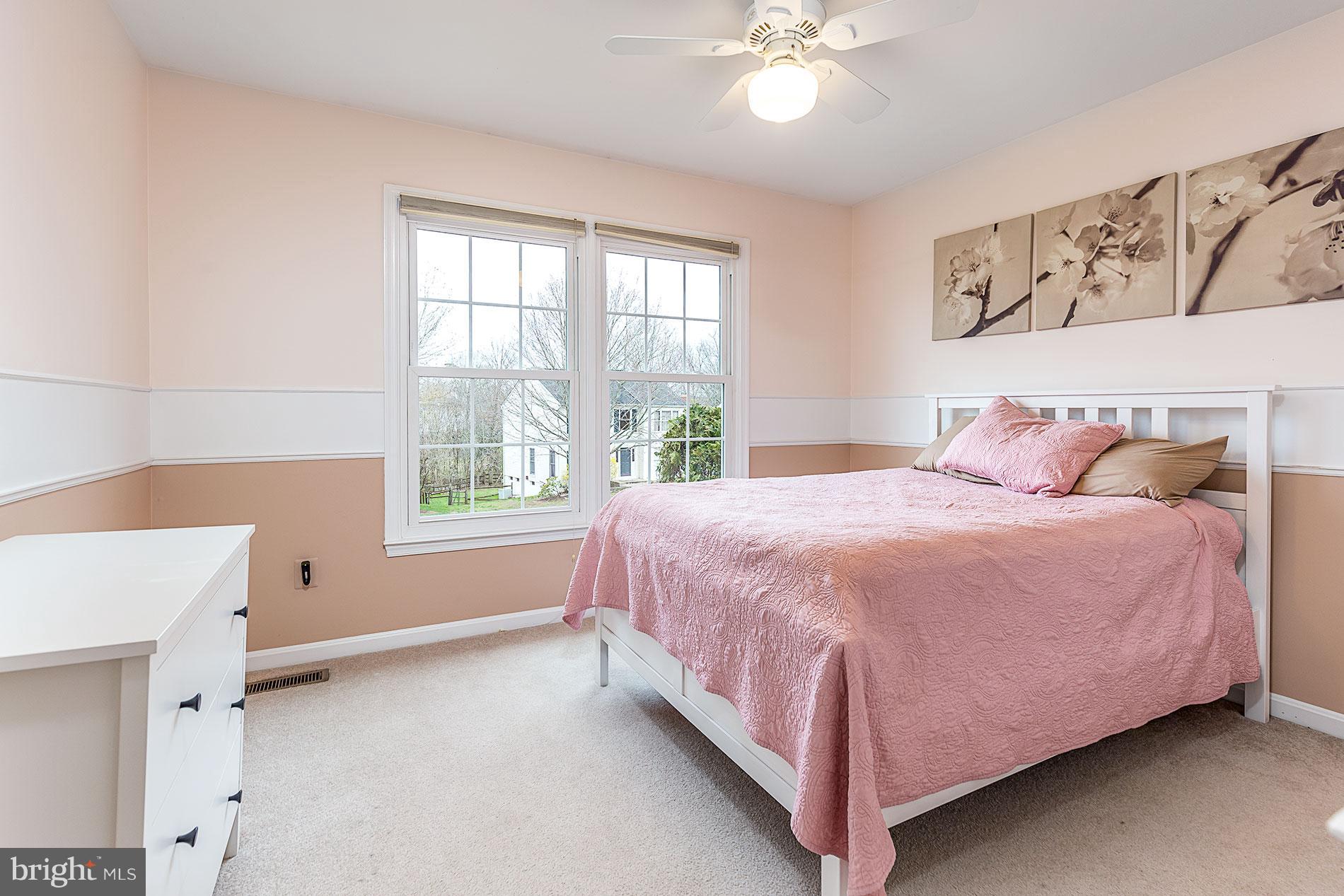 6453 Springhouse Circle Clifton, VA 20124 - Photo 22 of 30 a bedroom with a bed and window