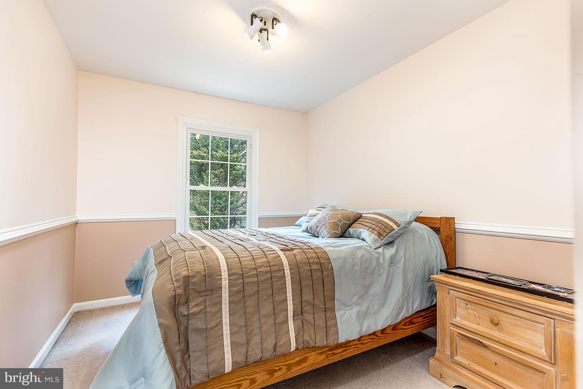 6453 Springhouse Circle Clifton, VA 20124 - Photo 23 of 30 a bedroom with a bed and window