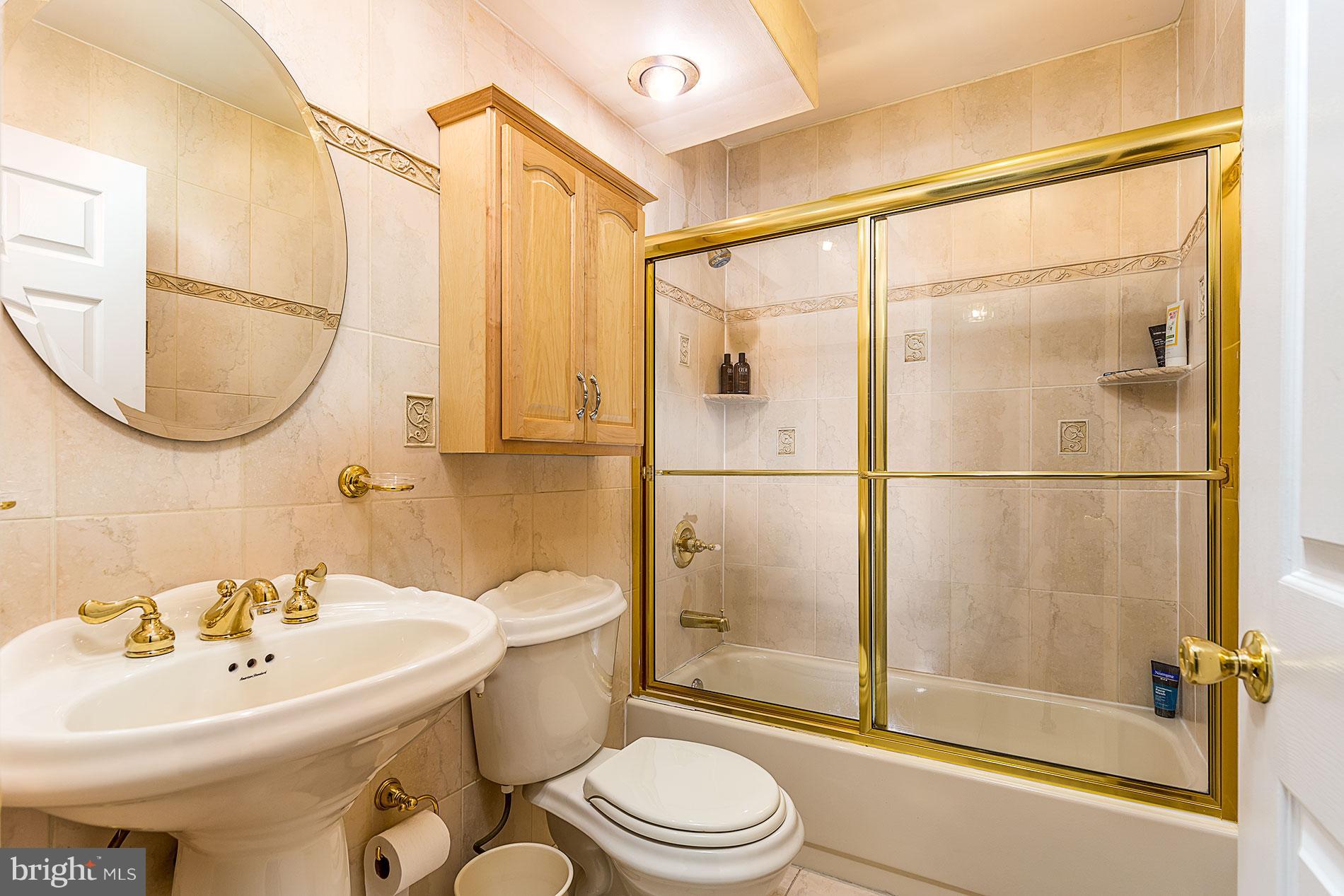 6453 Springhouse Circle Clifton, VA 20124 - Photo 24 of 30 a bathroom with a sink toilet and shower