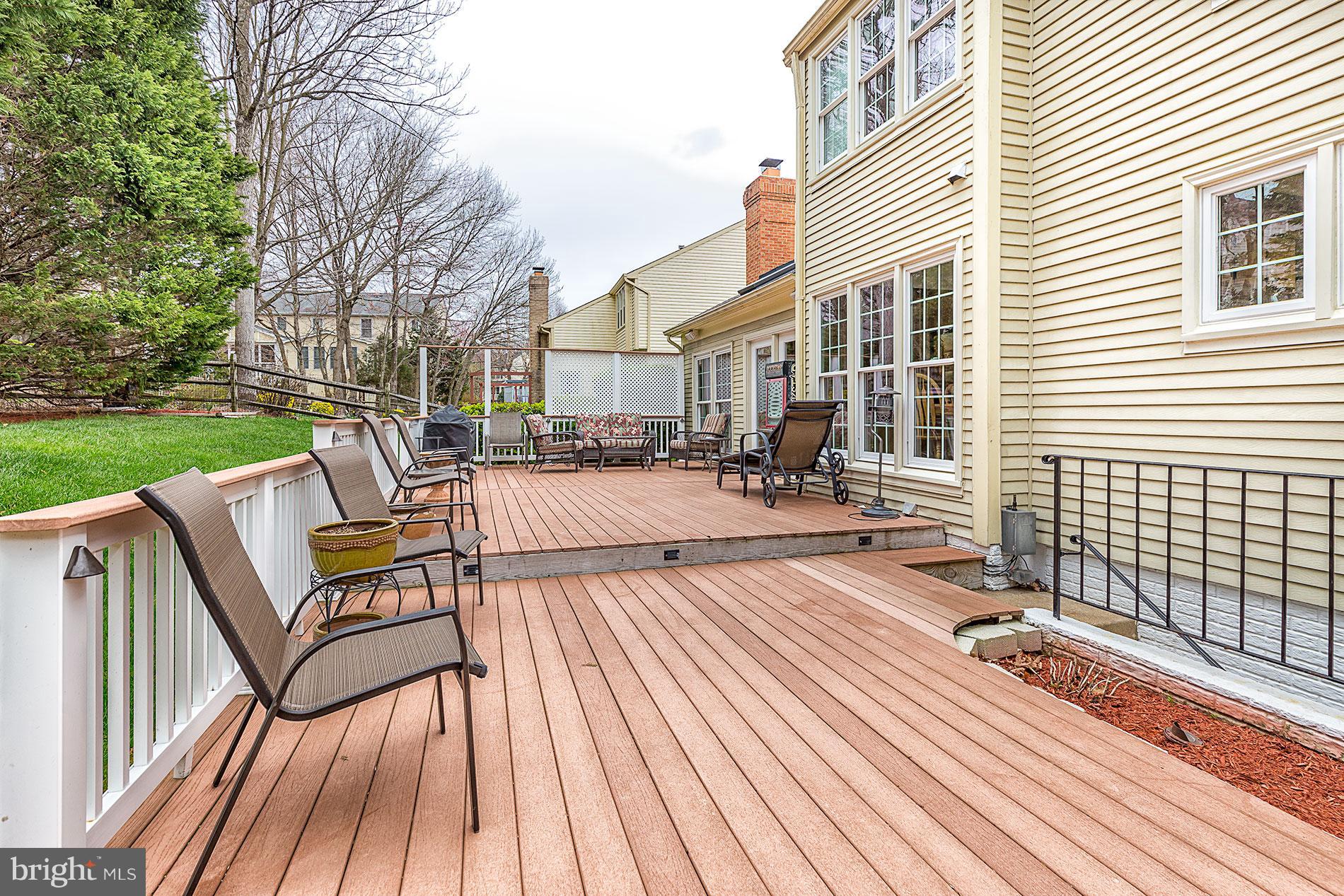 6453 Springhouse Circle Clifton, VA 20124 - Photo 28 of 30 a view of a roof deck with couches and wooden floor