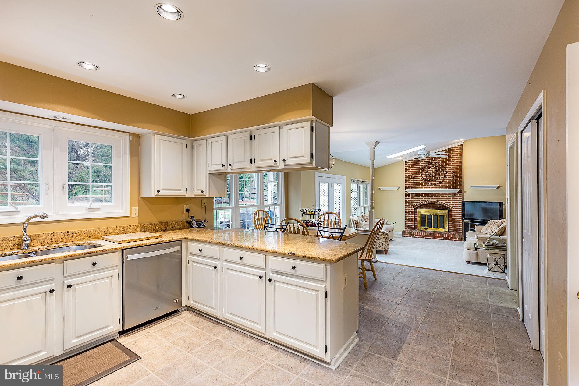 6453 Springhouse Circle Clifton, VA 20124 - Photo 9 of 30 a kitchen with a sink stove and cabinets