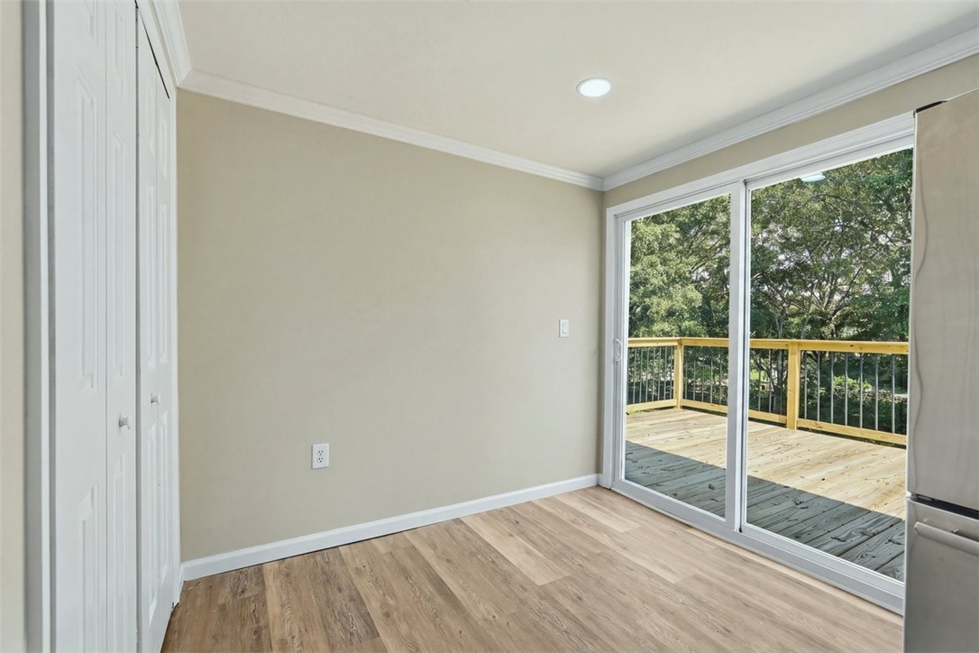 418 Old River Road Pelzer, SC 29669 - Photo 16 of 32 Sliding glass doors open from this sun-filled space directly onto a spacious wooden deck.