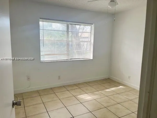 a view of a room that has a window in it