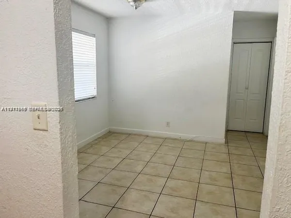a view of an empty room and window