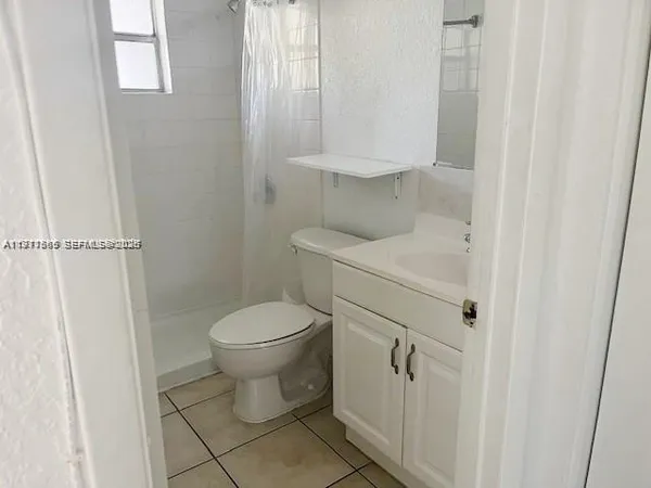 a bathroom with a toilet and a sink