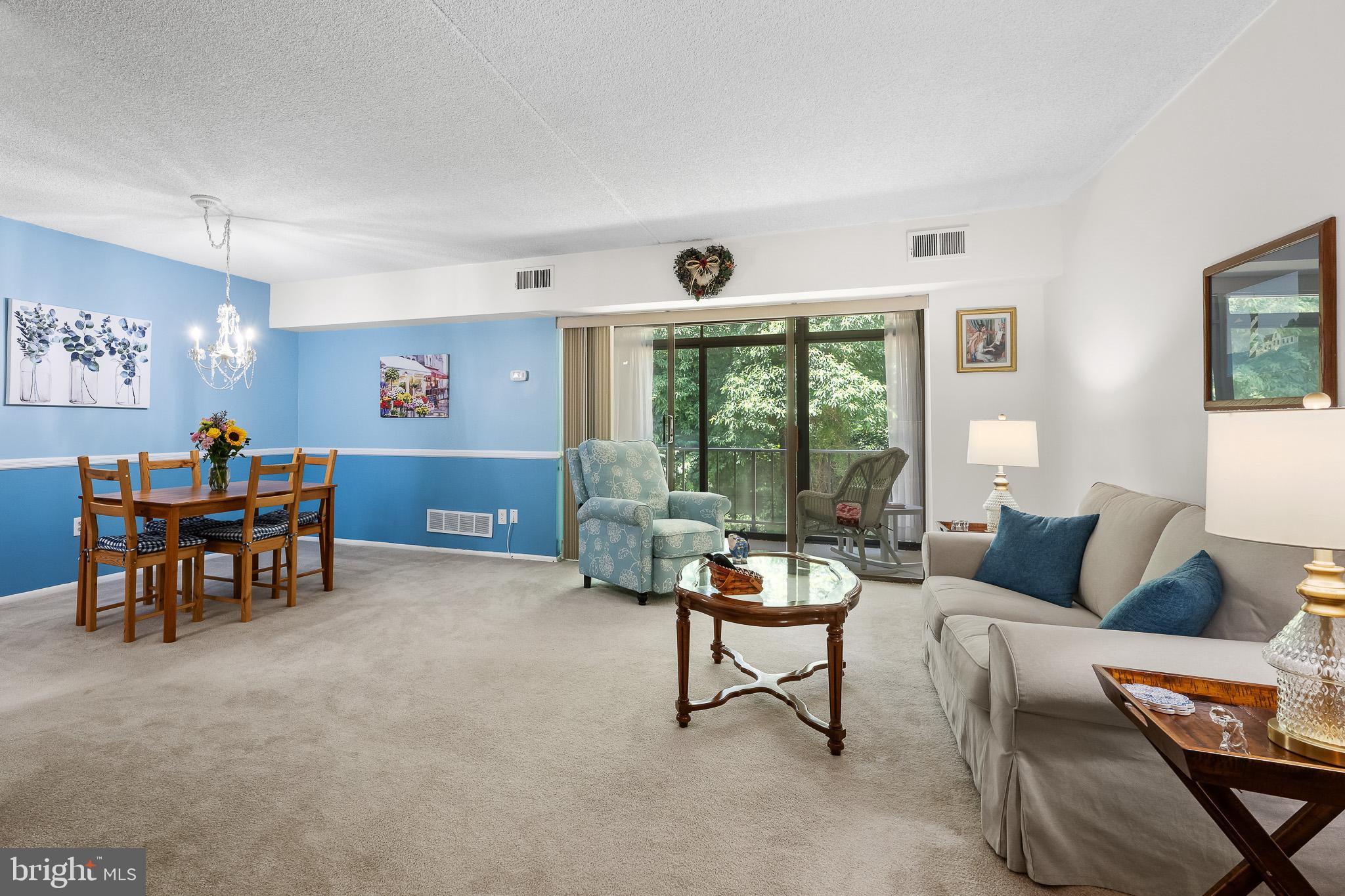 80 Welsh Tract Road, Unit 205 Newark, DE 19713 - Photo 2 of 23 Living room view to enclosed porch
