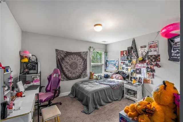 a bedroom with furniture and a bed