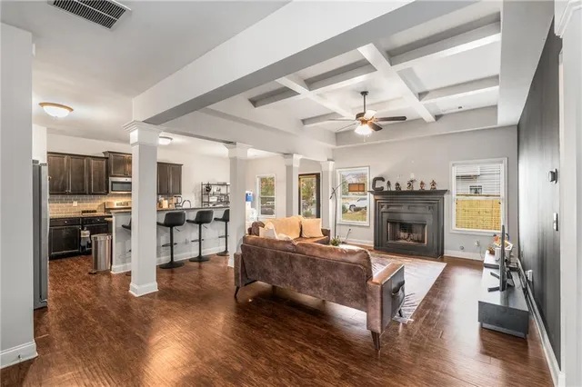 a living room with furniture and a fireplace