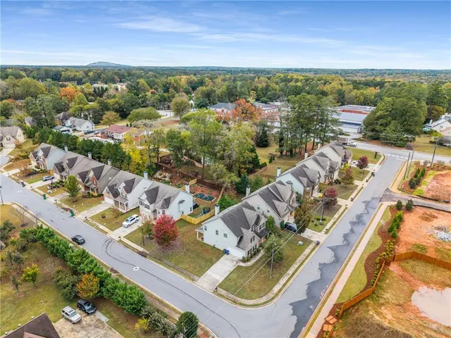 an aerial view of house with yard
