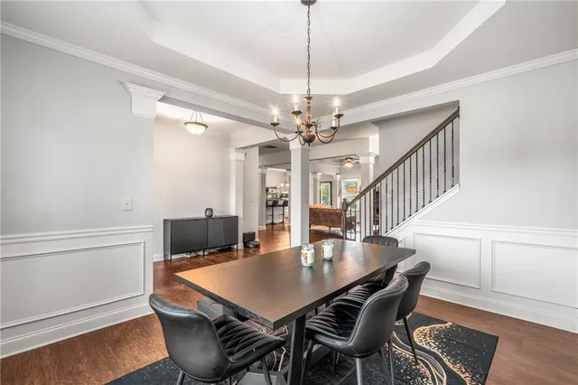 a view of a dining room with furniture and wooden floor