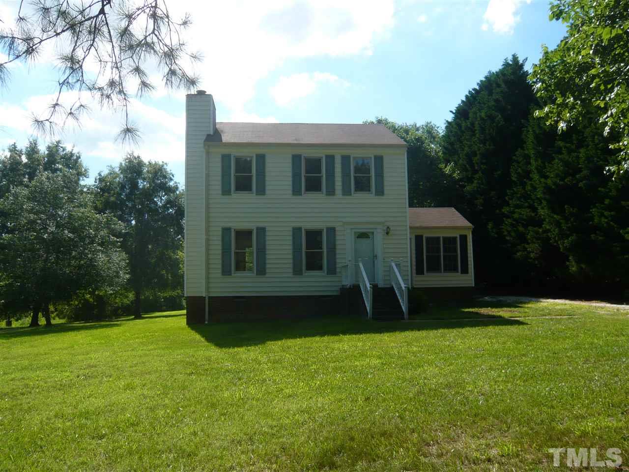 7301 Buck Road Wendell, NC 27591 - Photo 1 of 25 a view of a house with backyard and garden