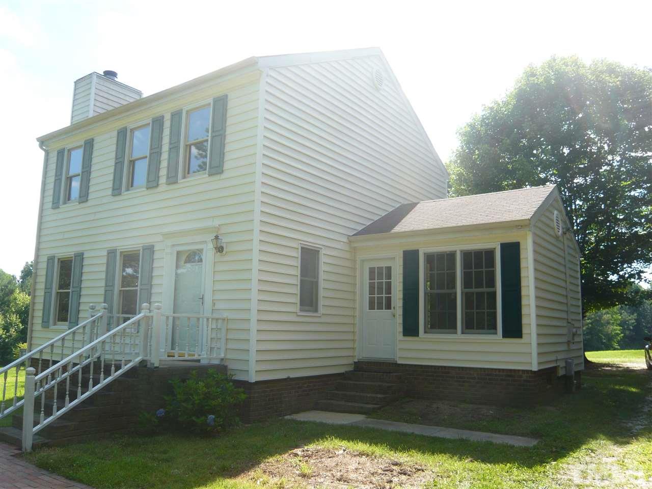 7301 Buck Road Wendell, NC 27591 - Photo 3 of 25 a front view of a house with a yard