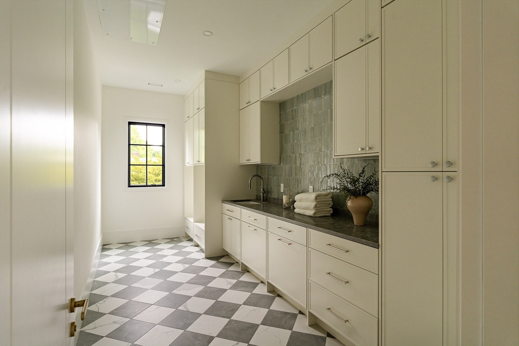 19 Bonnybrook Road Newton, MA 02468 - Photo 32 of 42 a bathroom with a sink a mirror and a shower