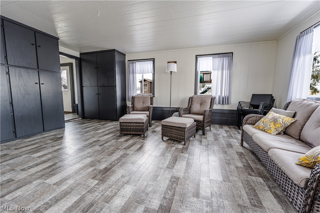 16350 Nauvoo Road Middlefield, OH 44062 - Photo 49 of 50 Living area featuring healthy amount of natural light and light wood-type flooring