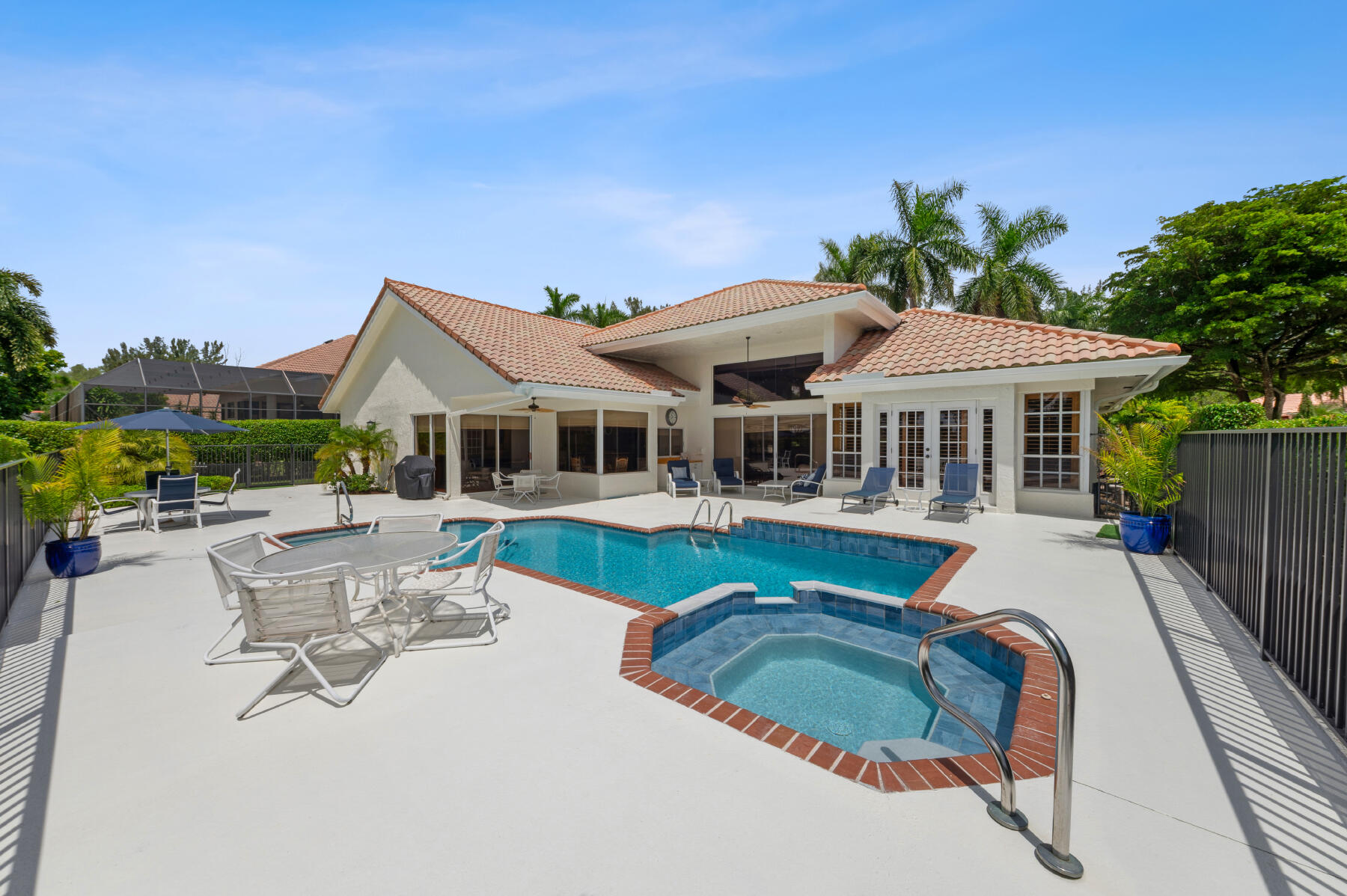 10403 Stonebridge Boulevard Boca Raton, FL 33498 - Photo 25 of 51 a house with swimming pool in front of it
