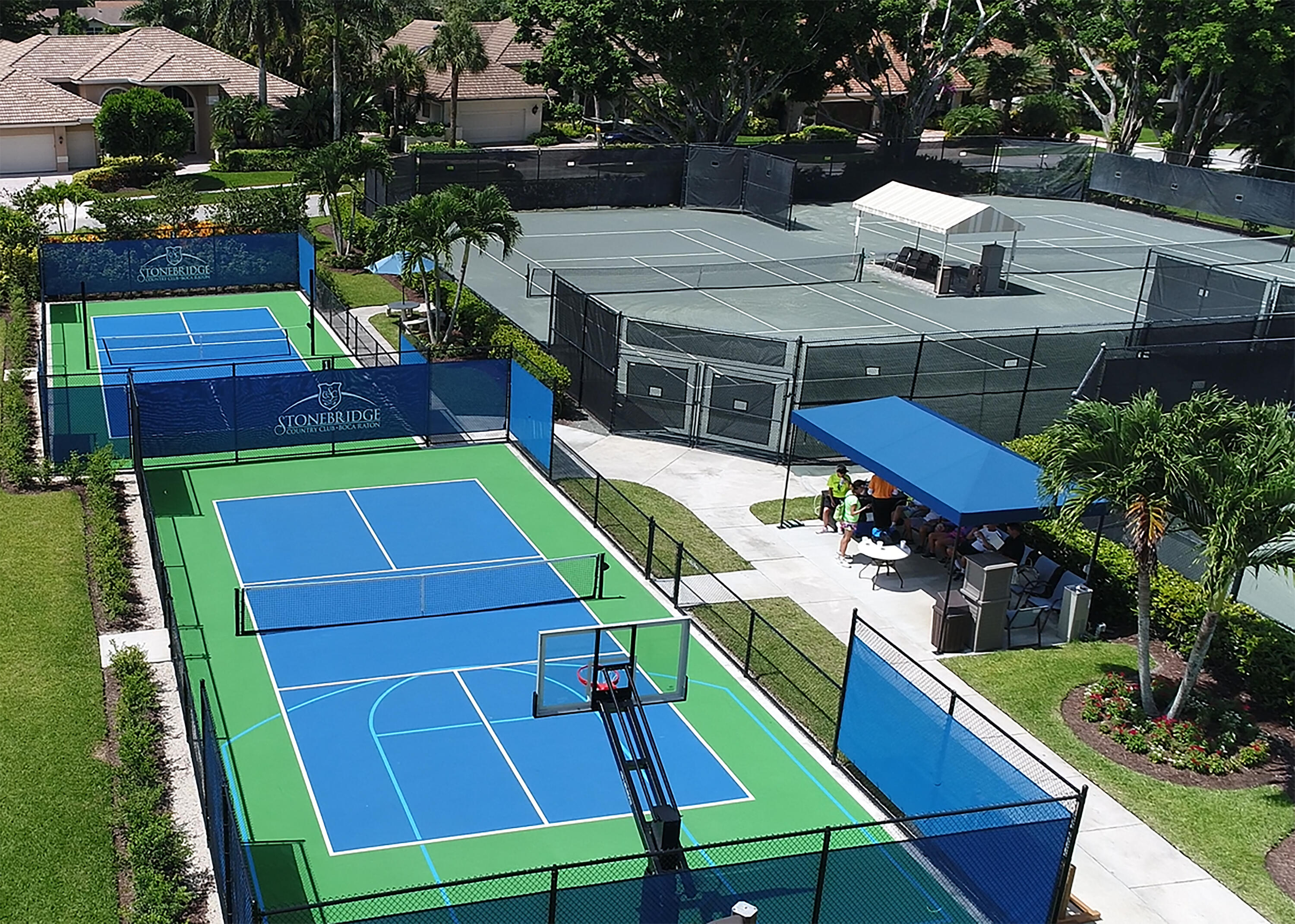 10403 Stonebridge Boulevard Boca Raton, FL 33498 - Photo 50 of 51 an aerial view of a house with pool and chairs