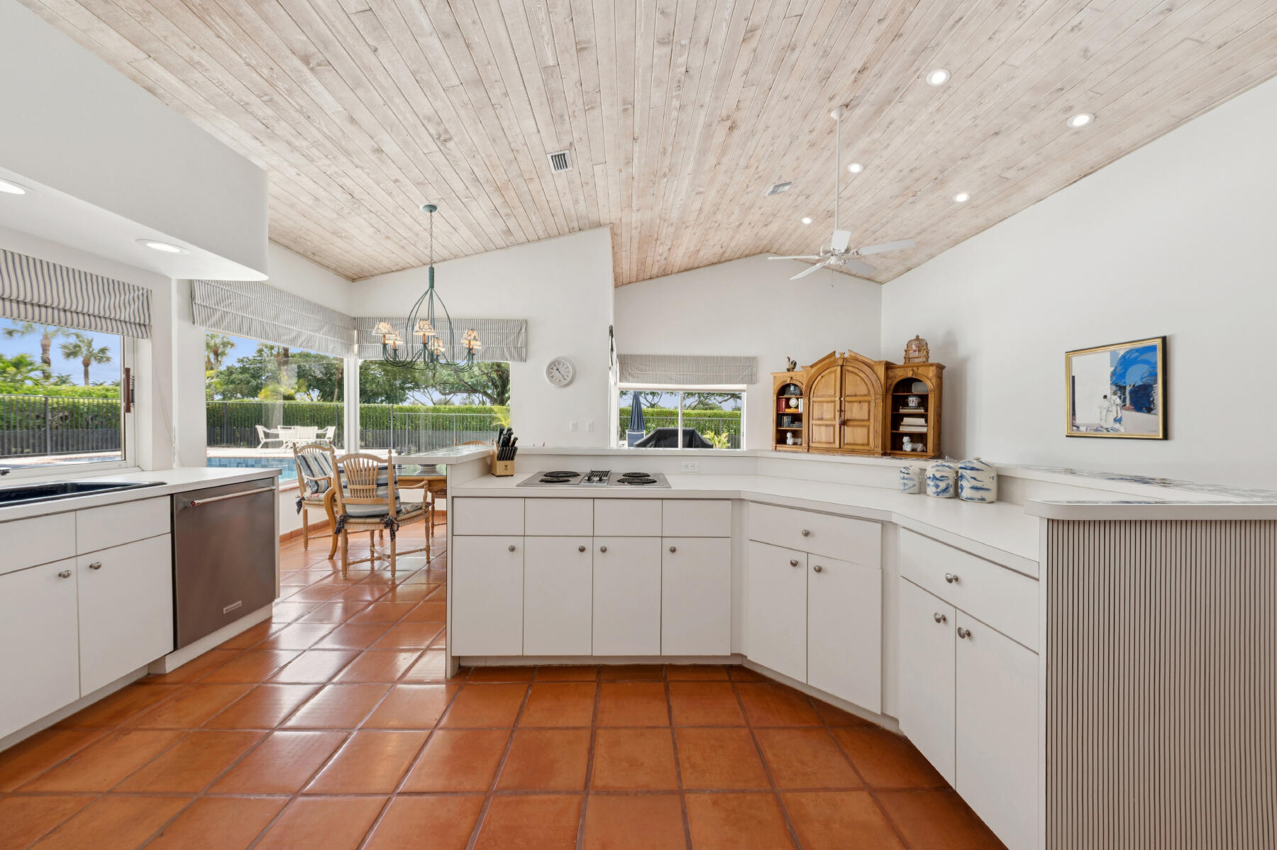 10403 Stonebridge Boulevard Boca Raton, FL 33498 - Photo 10 of 51 a large white kitchen with a large window