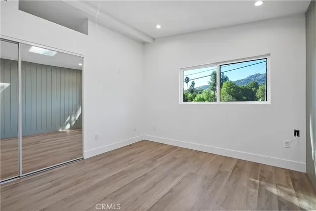 a view of a bathroom with sink and mirror