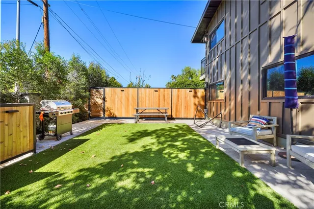a view of a backyard with sitting area