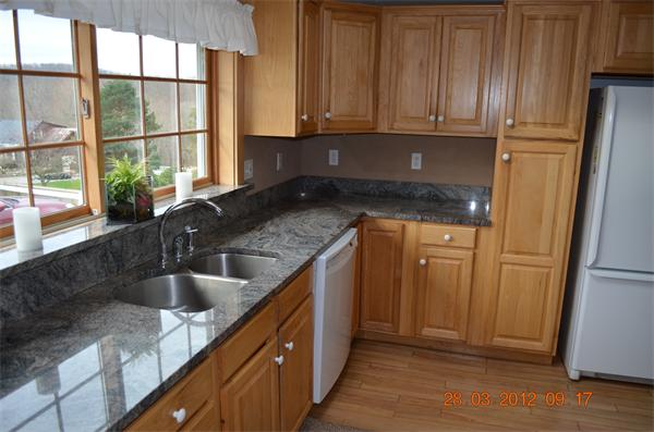 181 Butler Road Monson, MA 01057 - Photo 13 of 24 a kitchen with granite countertop a sink and a refrigerator