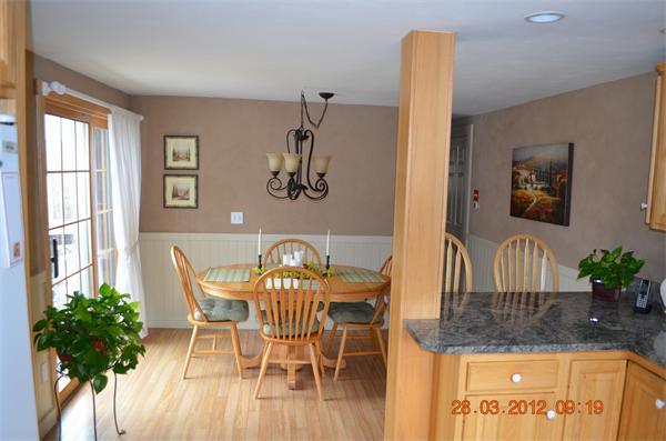 181 Butler Road Monson, MA 01057 - Photo 16 of 24 a view of a dining room with furniture and a potted plant