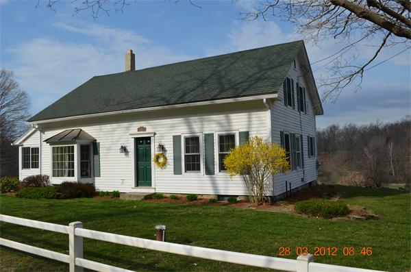 181 Butler Road Monson, MA 01057 - Photo 2 of 24 front view of a house with a yard