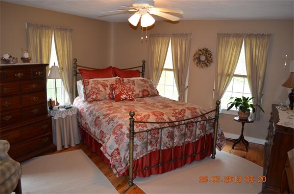 181 Butler Road Monson, MA 01057 - Photo 21 of 24 a bedroom with a bed and a chandelier