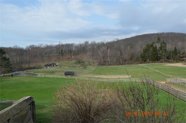 181 Butler Road Monson, MA 01057 - Photo 3 of 24 a view of a golf course with a lake