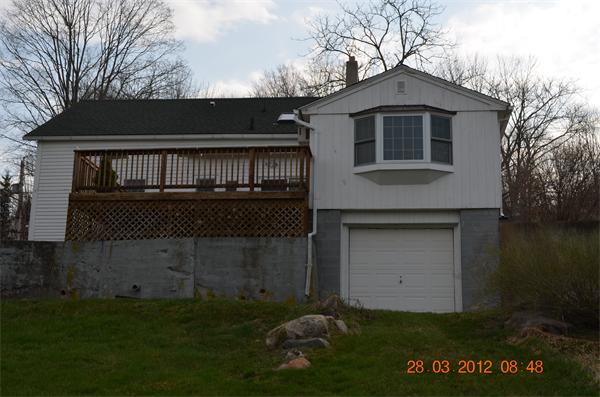 181 Butler Road Monson, MA 01057 - Photo 5 of 24 a front view of a house with a garden