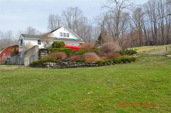 181 Butler Road Monson, MA 01057 - Photo 7 of 24 a front view of house with garden