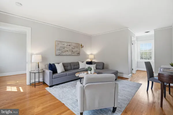 a living room with furniture and a table