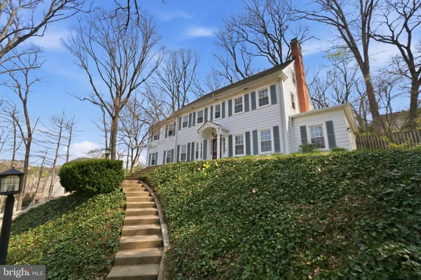 a view of a building with a yard